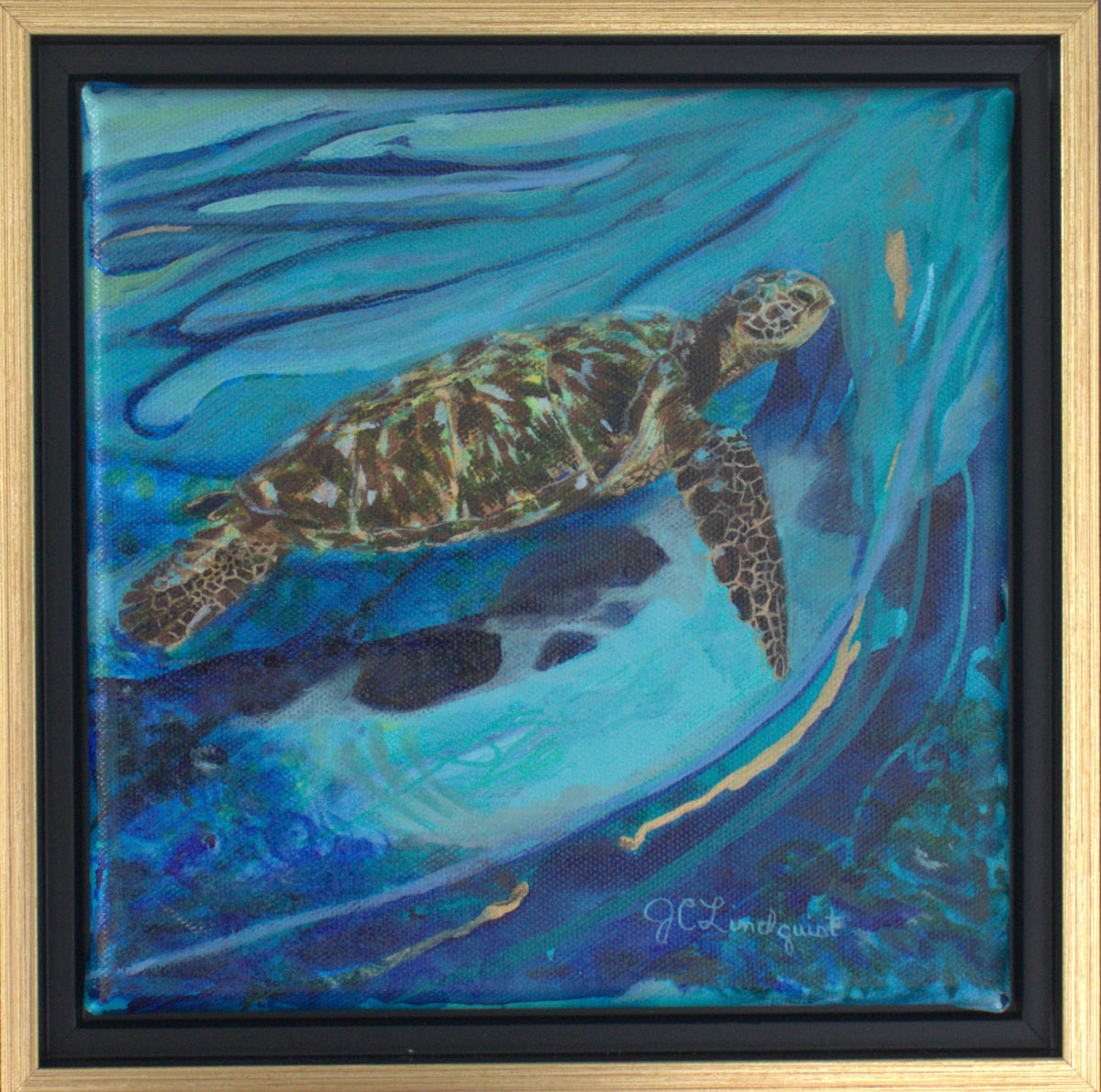 An acrylic painting of a sea turtle swimming underwater, framed in a black and gold floating frame. The painting features vibrant shades of blue, teal, and green, with the turtle depicted in profile.