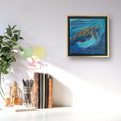 Image of a white desk with standing books, a jar of pencils and a jar with leaf stems.  On the wall is a sea turtle painting with a blue background inside a black and gold floating frame.