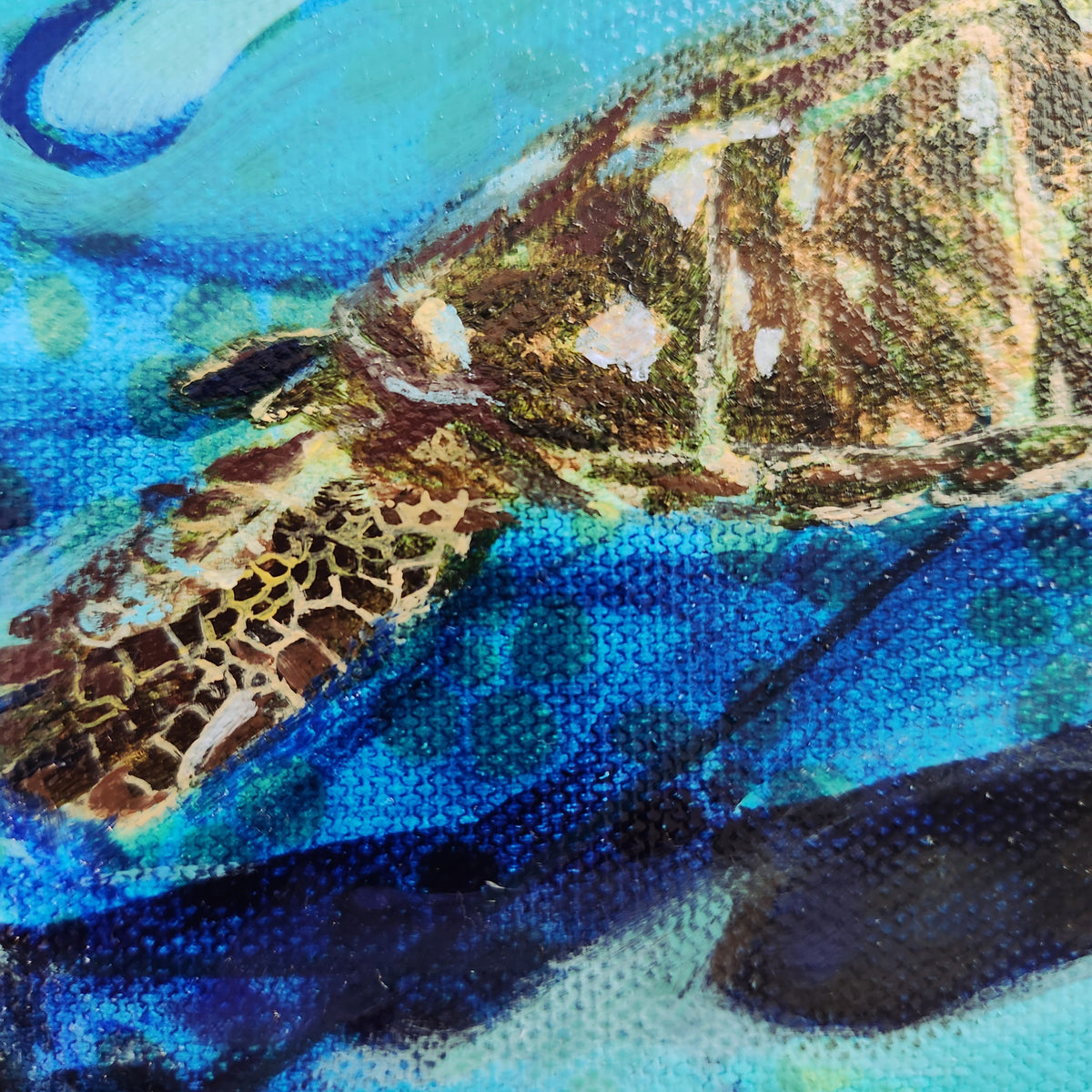 Close-up of a textured painting depicting a sea turtle swimming underwater, with vibrant blues, greens, and earthy brown tones.