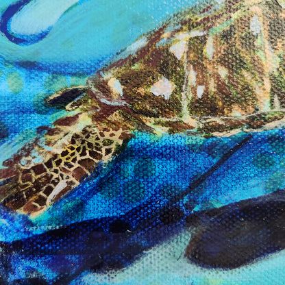Close-up of a textured painting depicting a sea turtle swimming underwater, with vibrant blues, greens, and earthy brown tones.